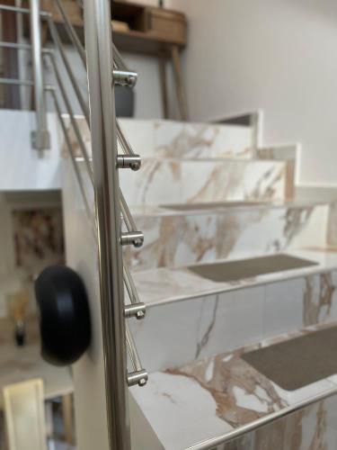 a close up of a metal rack in a room at Giouli's Maison in Eretria