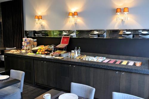 a restaurant kitchen with a large counter top at The Market by Parkhotel in Kortrijk