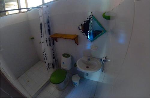 a small bathroom with a shower and a toilet at Hostal Zinpar in Palomino