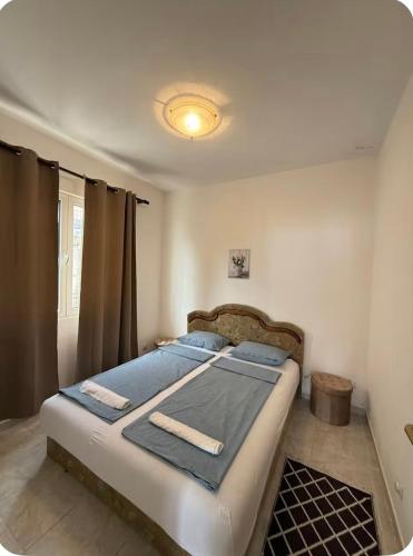a bedroom with a bed in a room at Vista apartments in Risan