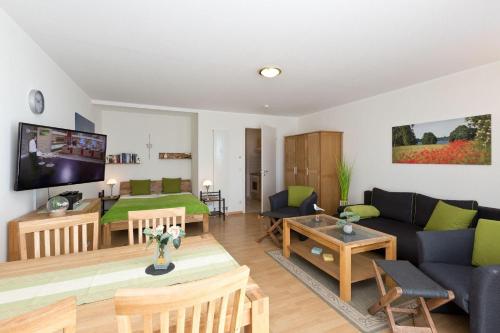 a living room with a couch and a table at Am Seeufer 59b Fewo 3 in Waren