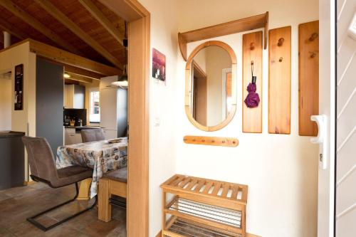 a door leading into a dining room with a table at Ferienhaus Jabel 28 in Jabel