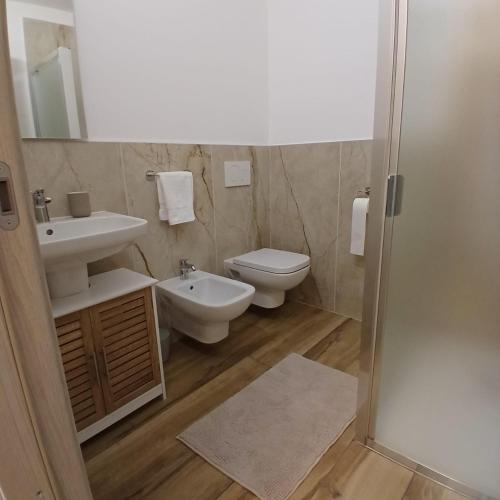 a bathroom with a toilet and a sink at Il Rifugio in Franciacorta in Erbusco