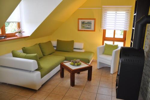 a living room with a couch and a table at Fair-Play App 04 DG R in Göhren-Lebbin
