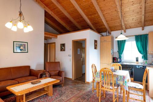 a living room with a couch and a table at Ferienhaus Jabel 26 in Jabel