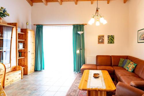 a living room with a couch and a table at Ferienhaus Jabel 26 in Jabel
