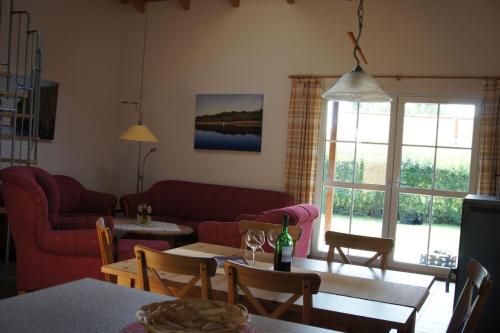a living room with a couch and a table at Ferienhaus Jabel 29 in Jabel