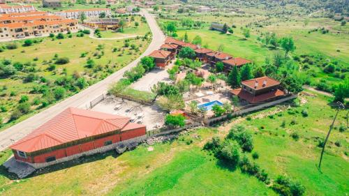 an aerial view of a house with a yard at Complejo rural el Hosquillo Serranía de Cuenca in Cuenca