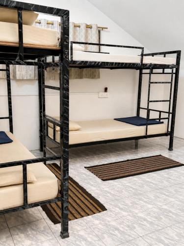 a group of bunk beds in a room at Zion Backpackers Hostel in Guwahati