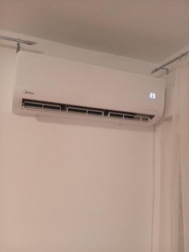 a ceiling mounted air conditioner in a room at Sladjana apartman in Prijepolje