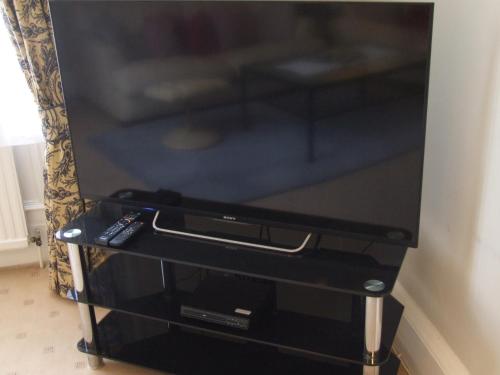 A television and/or entertainment center at Bank View Self Catering Apartment 