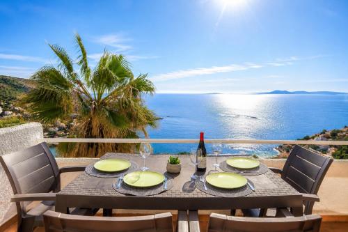 a dining table with a view of the ocean at Ibiza Bramer 7 - ImmoBarneda in Roses