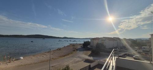 a view of a beach with boats in the water at ERE Apartment in Srima