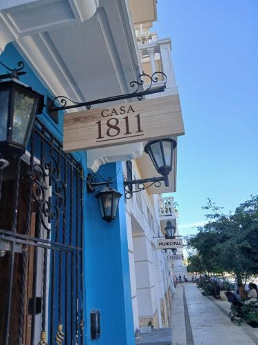 a sign for a casa on the side of a building at Casa 1811 in Cartagena de Indias