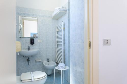 a bathroom with a toilet and a sink at Hotel Verbena in Lido di Camaiore