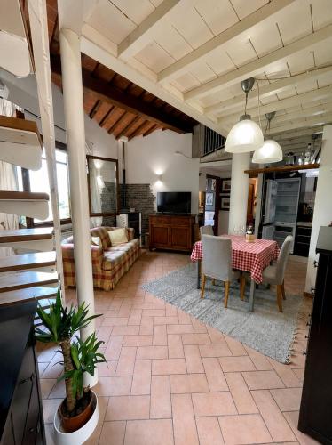 a living room with a table and a couch at Mugello View in Bovecchio