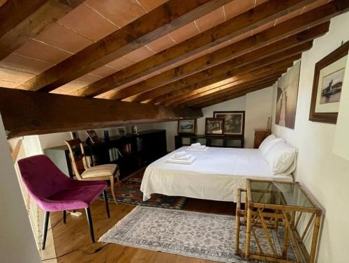 a bedroom with a bed and a table and chairs at Mugello View in Bovecchio