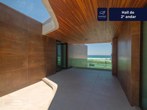 a hallway of a building with a view of the ocean at Marino Beach Hotel in Cabo Frio