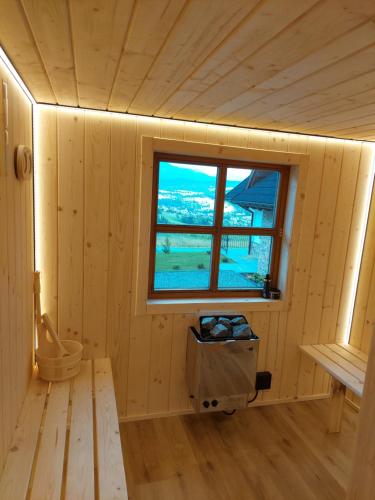 a wooden room with a window and a toilet at Domek na Bachledowce 2 in Czerwienne