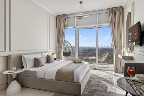 a bedroom with a large bed and a large window at FIRST CLASS Studio Inviting Luxury Escape in Dubai Marina
