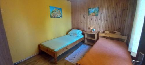 a small room with a small bed and a desk at Kļūda1 in Biksinīki