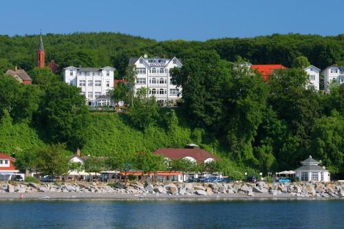 a group of buildings on a hill next to the water at Apartment Feodora in Sassnitz