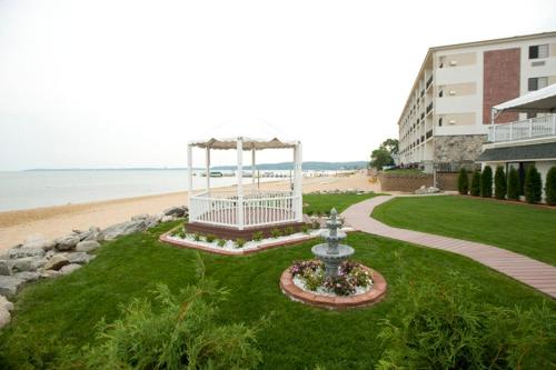 a park with a gazebo next to the beach at Parkshore Resort in Traverse City