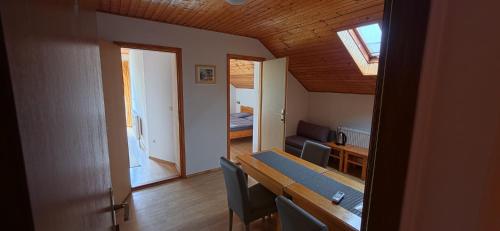 a room with a dining table and a living room at Guesthouse Mirko Hodak in Seliste Dreznicko