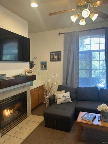 a living room with a couch and a fireplace at The Cottage on the Coast in Oceano