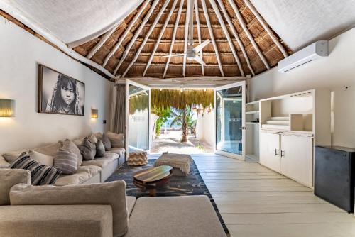 a living room with a couch and a table at Hotel Qamar in Tulum