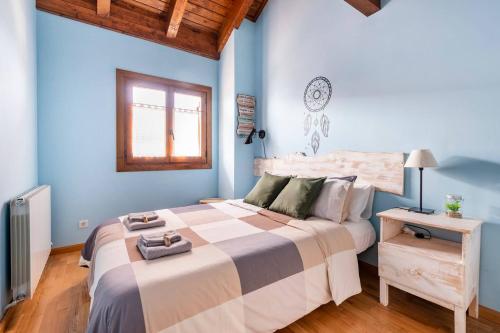 a bedroom with a large bed and a window at La Voz del Silencio in Neril
