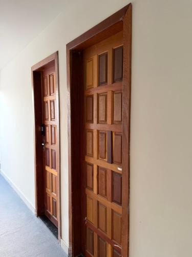 a pair of doors in a room at Hostel do moreno in Vila Velha