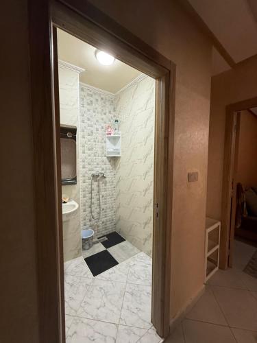 a bathroom with a shower and a toilet at Sunset Stay Anza in Agadir