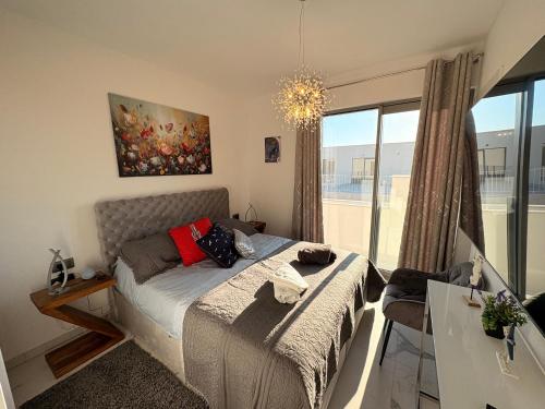 a bedroom with a bed and a large window at Villa Oasis mit Meerblick in Supetar