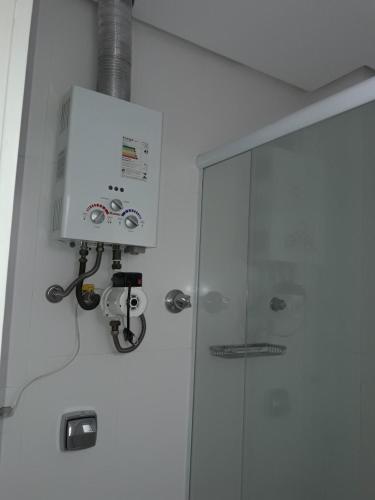 a bathroom with a shower and a glass door at Apartamento em Copacabana in Rio de Janeiro