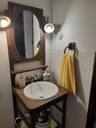 a bathroom with a sink and a mirror at Vega in Muñás