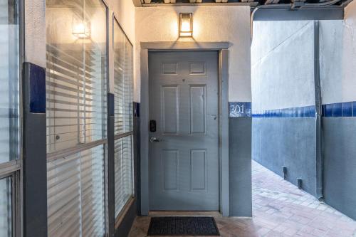 a hallway with a door with a light on top at Austin Apartments by Andes STR in Austin