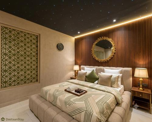 a bedroom with a large bed and a mirror at Hotel Mashabrum Skardu in Skardu