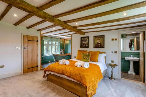 a bedroom with a bed with two towels on it at 11 Bed in Stebbing oc-p34450 in Stebbing