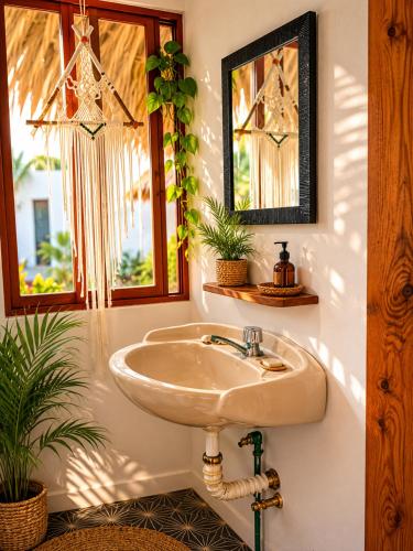 a bathroom with a sink and a window at Siete Mares in Guayabas