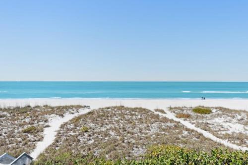 an aerial view of a beach with the ocean at Hidden Cove Unit 6 in Holmes Beach