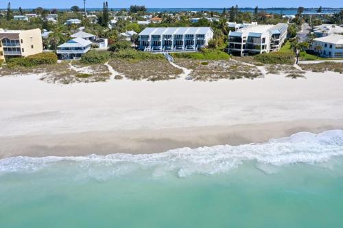 an aerial view of the beach and the ocean at Hidden Cove Unit 6 in Holmes Beach