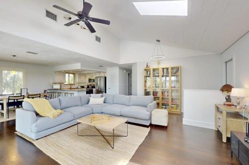 a living room with a couch and a table at Spring Oasis in Anna Maria