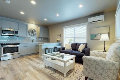 a living room with a couch and a table at South Bay Inn 1 in Anna Maria