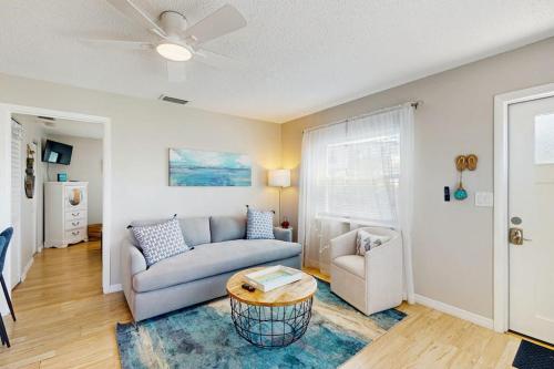 a living room with a couch and a table at Bay View Inn 202 in Bradenton Beach