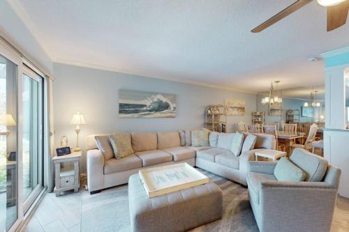 a living room with a couch and a table at Gulf Place 19 in Holmes Beach
