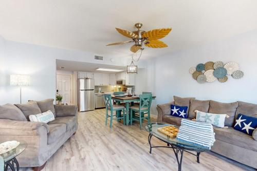 a living room with a couch and a table at Fountain Head 5 in Holmes Beach