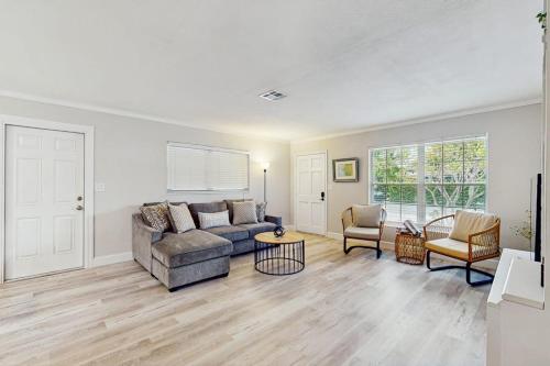 a living room with a couch and a table at Mint Green Getaway in Holmes Beach