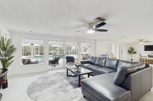 a living room with a couch and a table at Anna Maria's Finest in Anna Maria