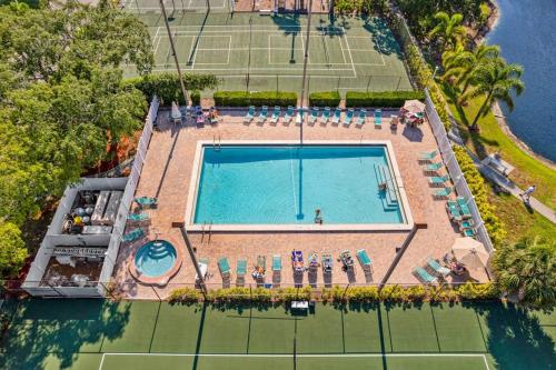an overhead view of a swimming pool and tennis court at Shorewalk Villa in Bradenton